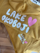 Load image into Gallery viewer, mustard hoodie lake okoboji w/ pink heart